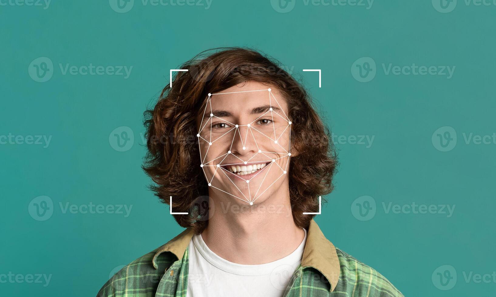 A young individual with curly hair smiles at the camera while a facial recognition overlay highlights key features. This demonstrates advanced identification technology in a simple, clean environment. photo