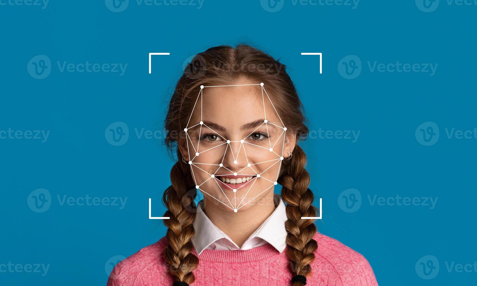 A young woman with braided hair smiles against a solid blue background, showcasing facial recognition technology with geometric facial mapping lines identifying her features. photo