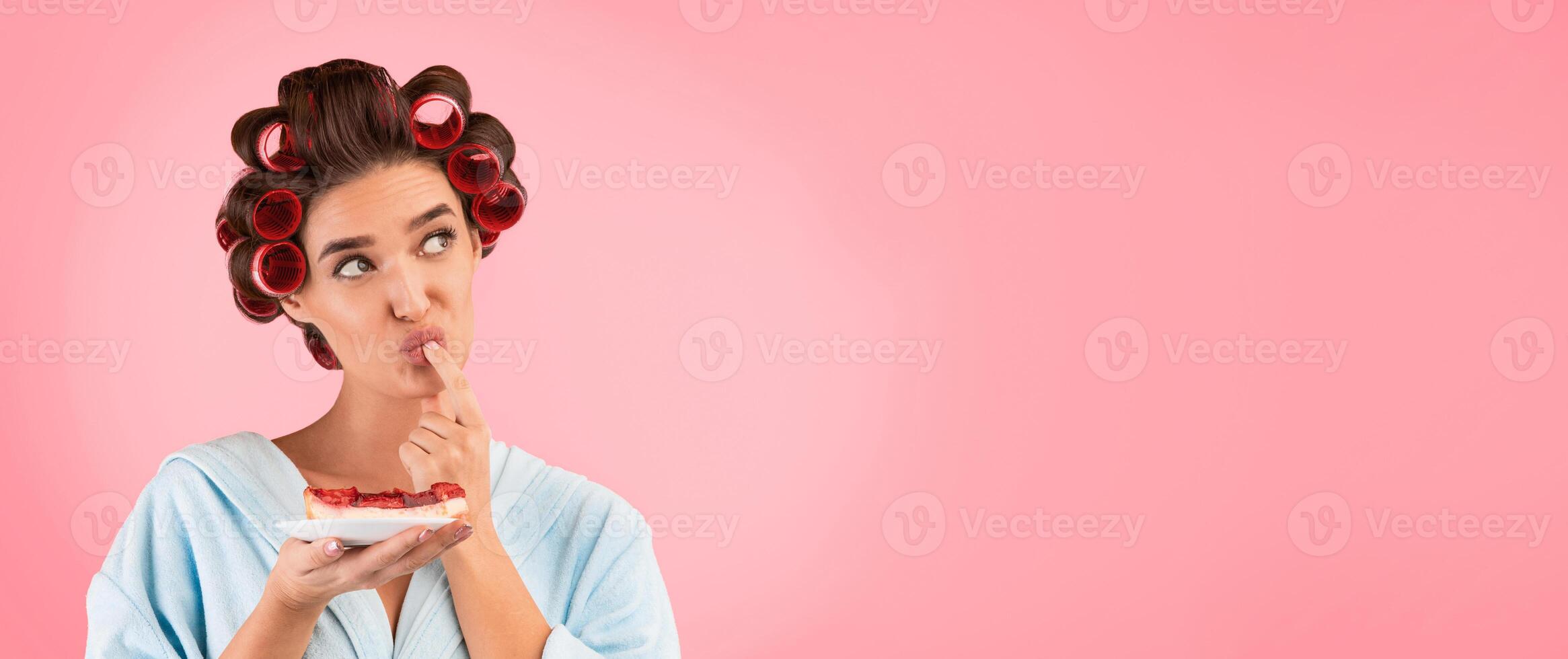 Cheat Meal Concept. Hungry Housewife Tasting Cake Standing Over Yellow Studio Background. Panorama, Free Space For Text photo