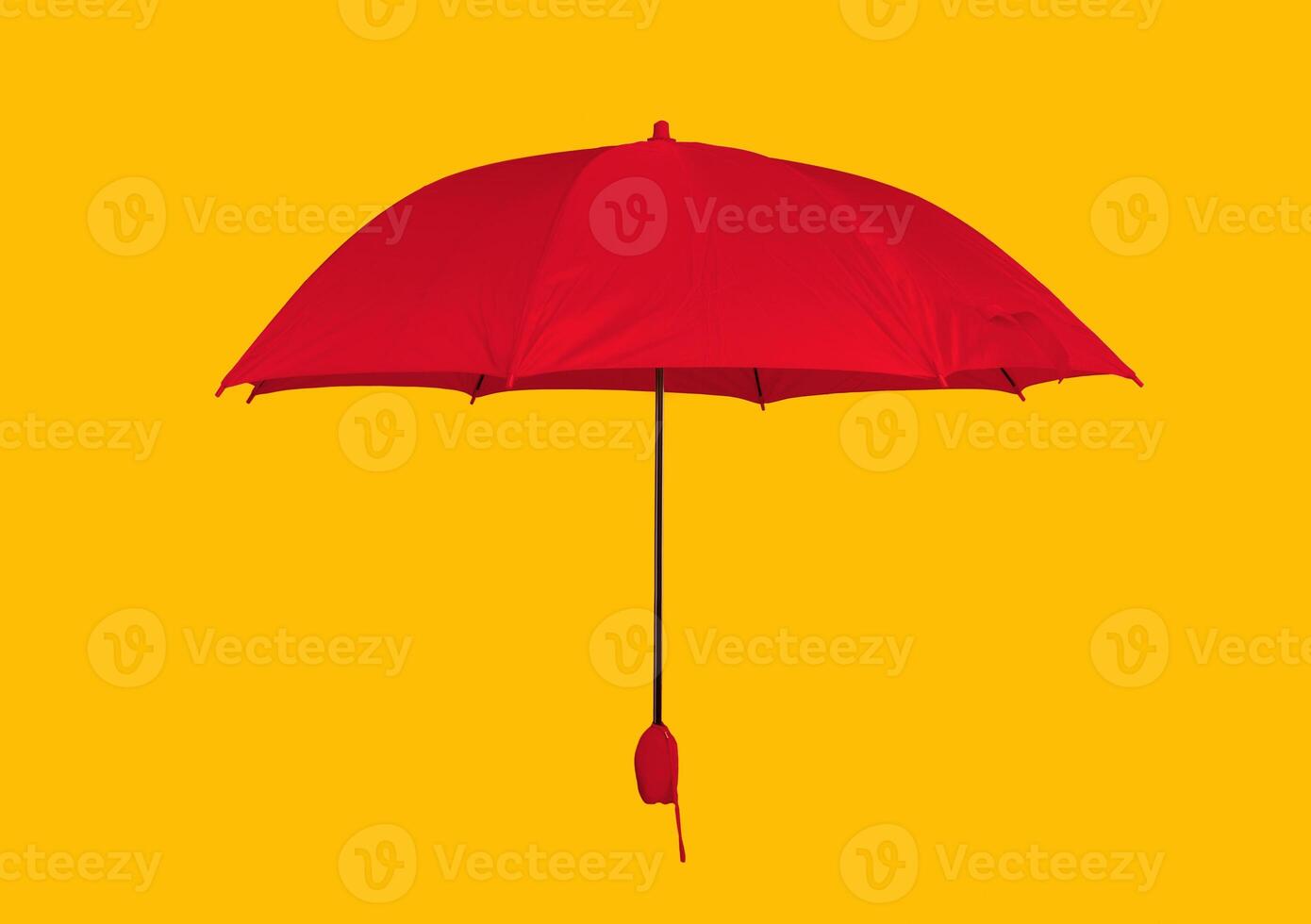 Opened yellow umbrella isolated on pastel pink studio background photo
