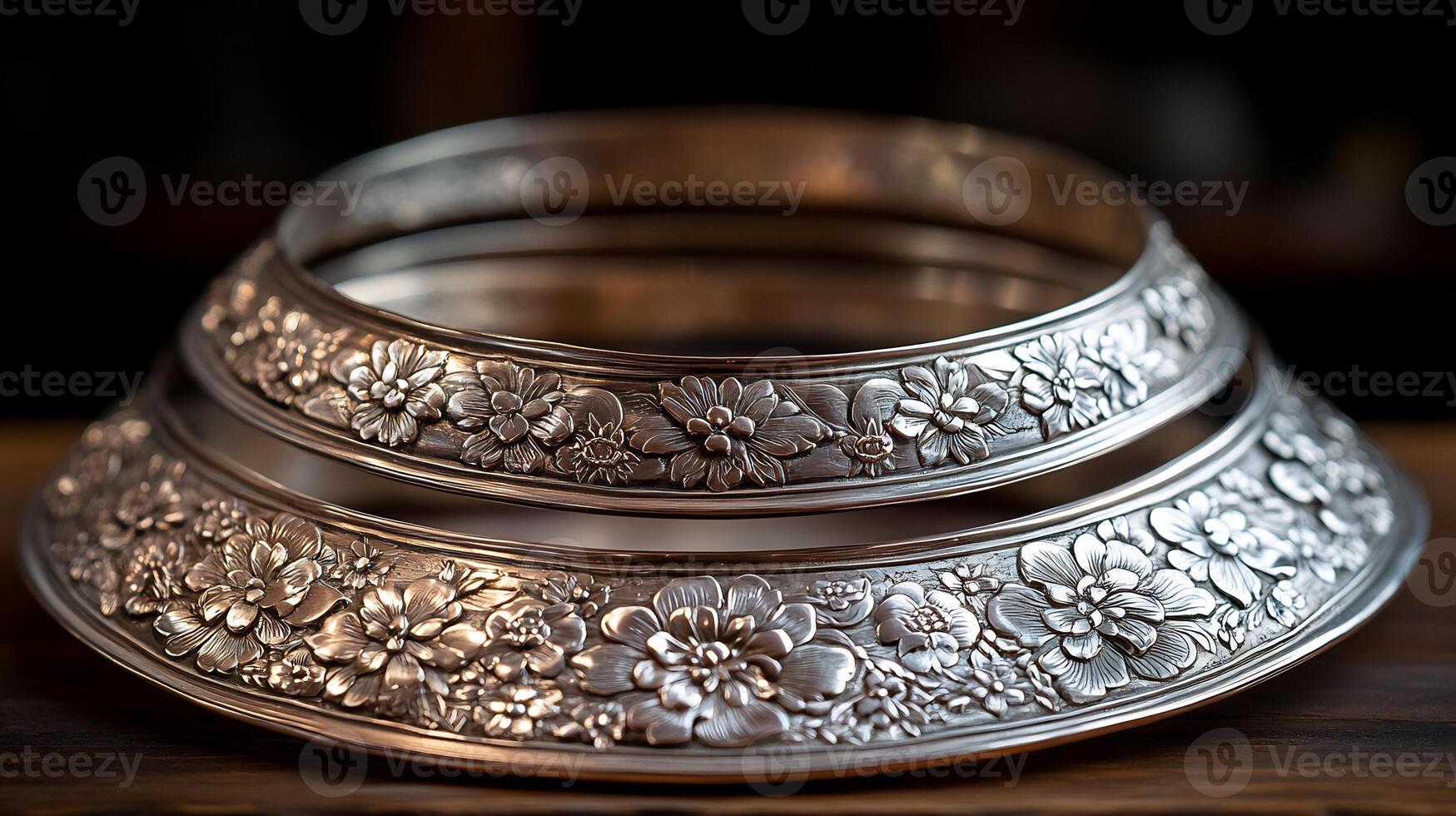 A silver bowl with flowers on it photo