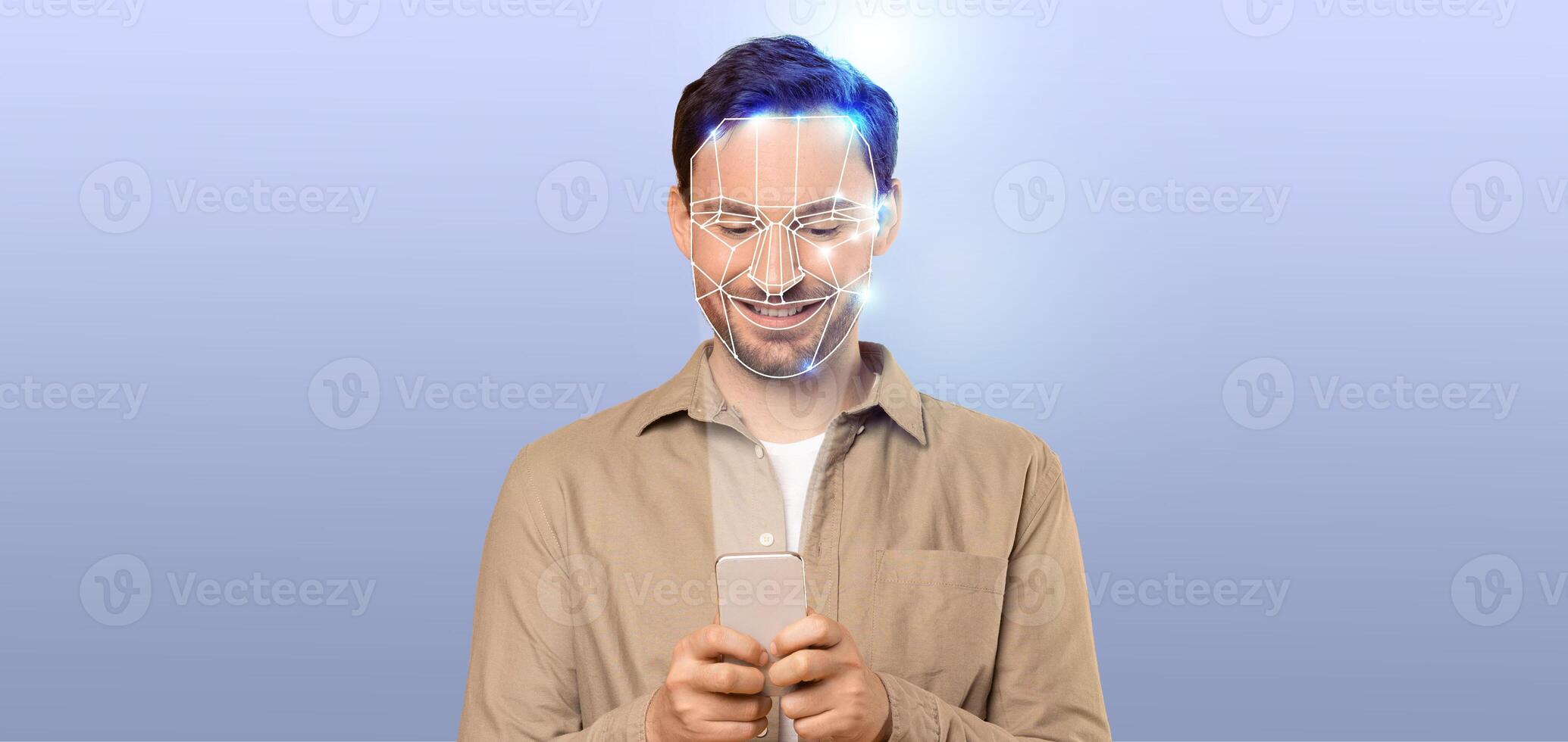 A person is engaged with a smartphone, using modern facial recognition technology. photo