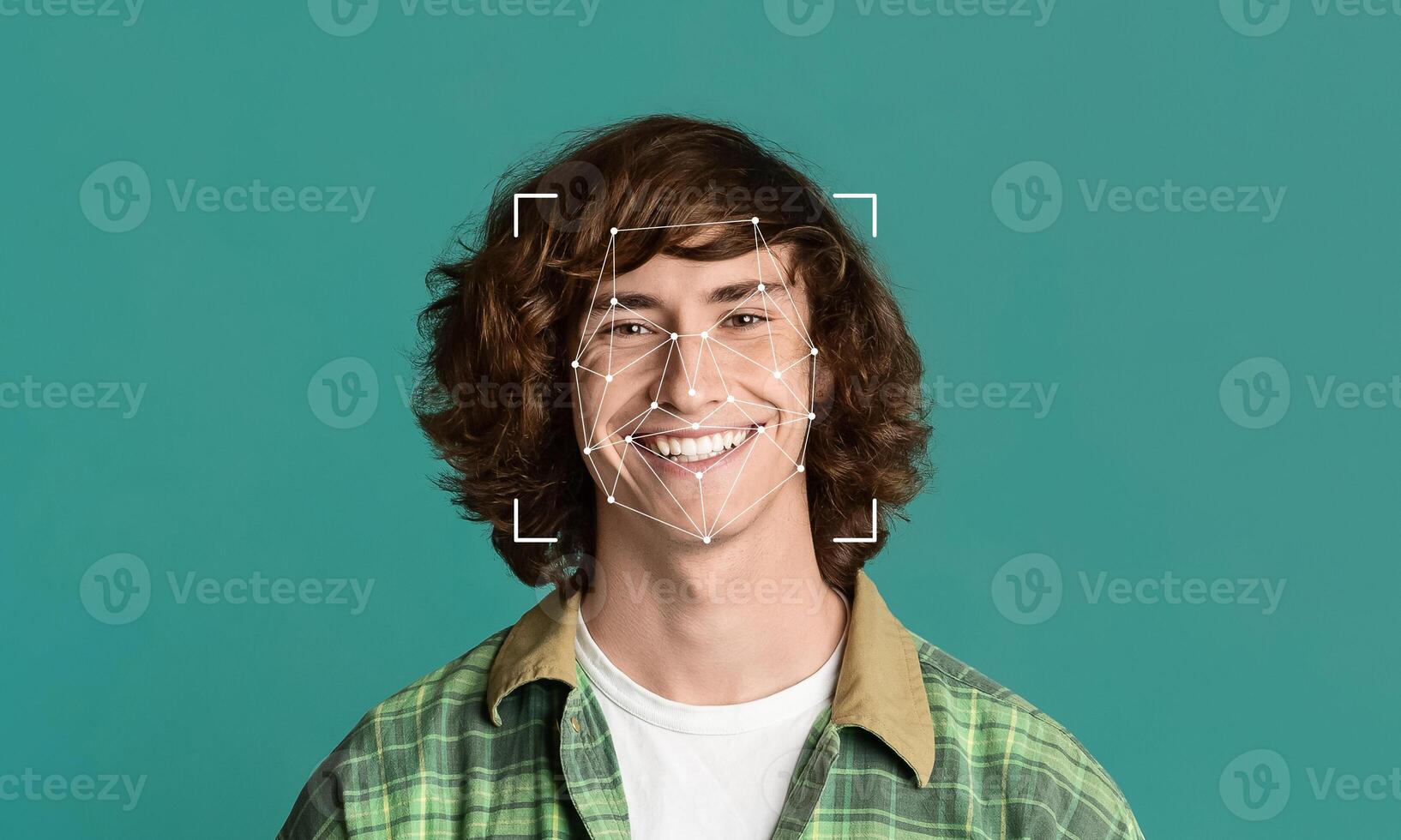 A young person with curly hair is smiling, with facial identification markers displayed around their face. The solid background emphasizes the subject and technology used in facial recognition. photo