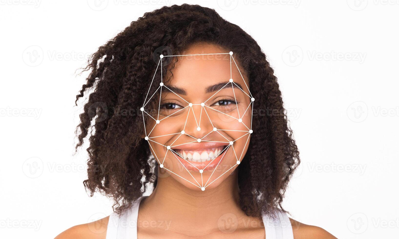 A woman with curly hair smiles brightly as facial recognition technology scans her face. photo