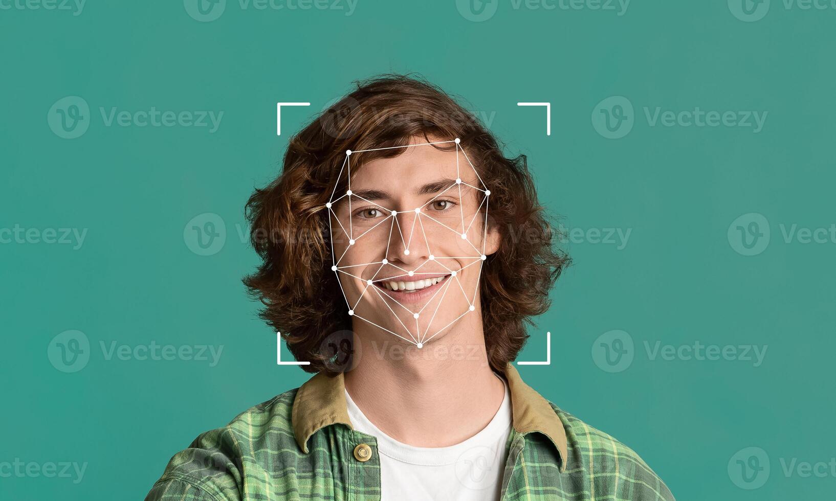A young man with curly hair smiles confidently while facial recognition technology captures his features. The background is a solid color, highlighting the tech's application in identification. photo
