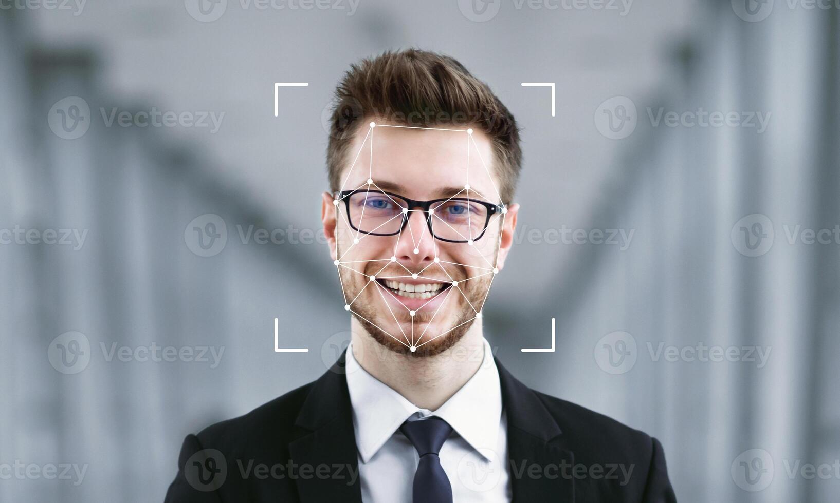 A man in formal attire smiles while facial recognition software identifies him. The background features soft architectural lines, enhancing the focus on identification technology. photo