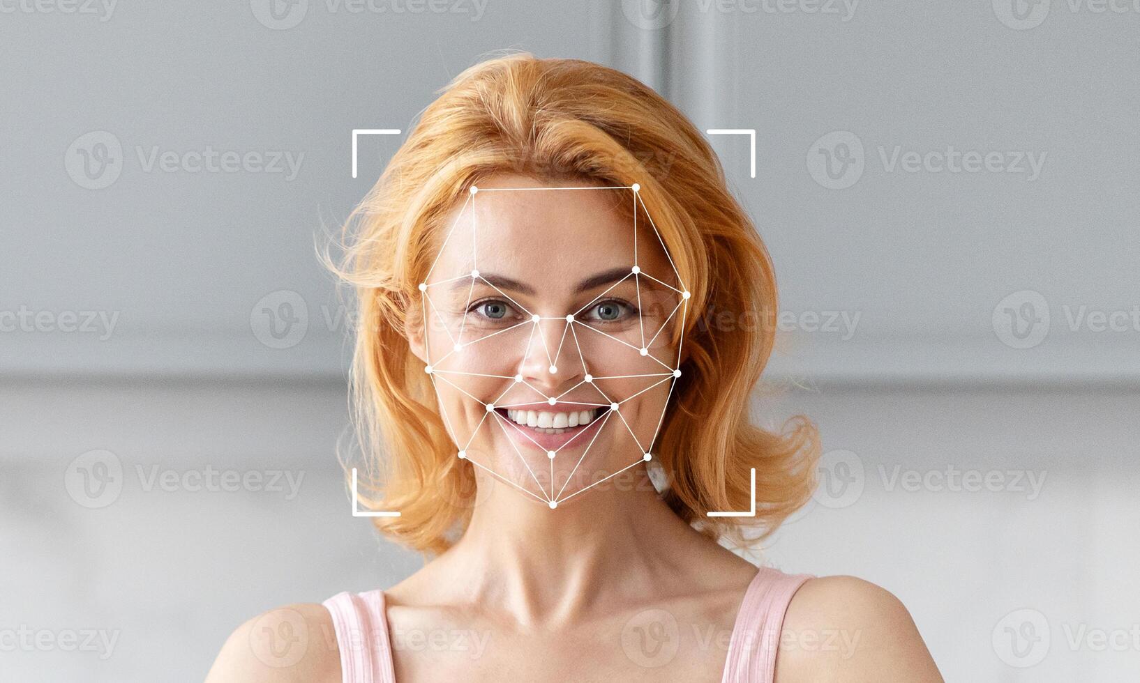 A woman with blonde hair smiles while facial recognition technology scans her face. The background features a neutral, contemporary space with empty areas, suggesting a focus on technology. photo
