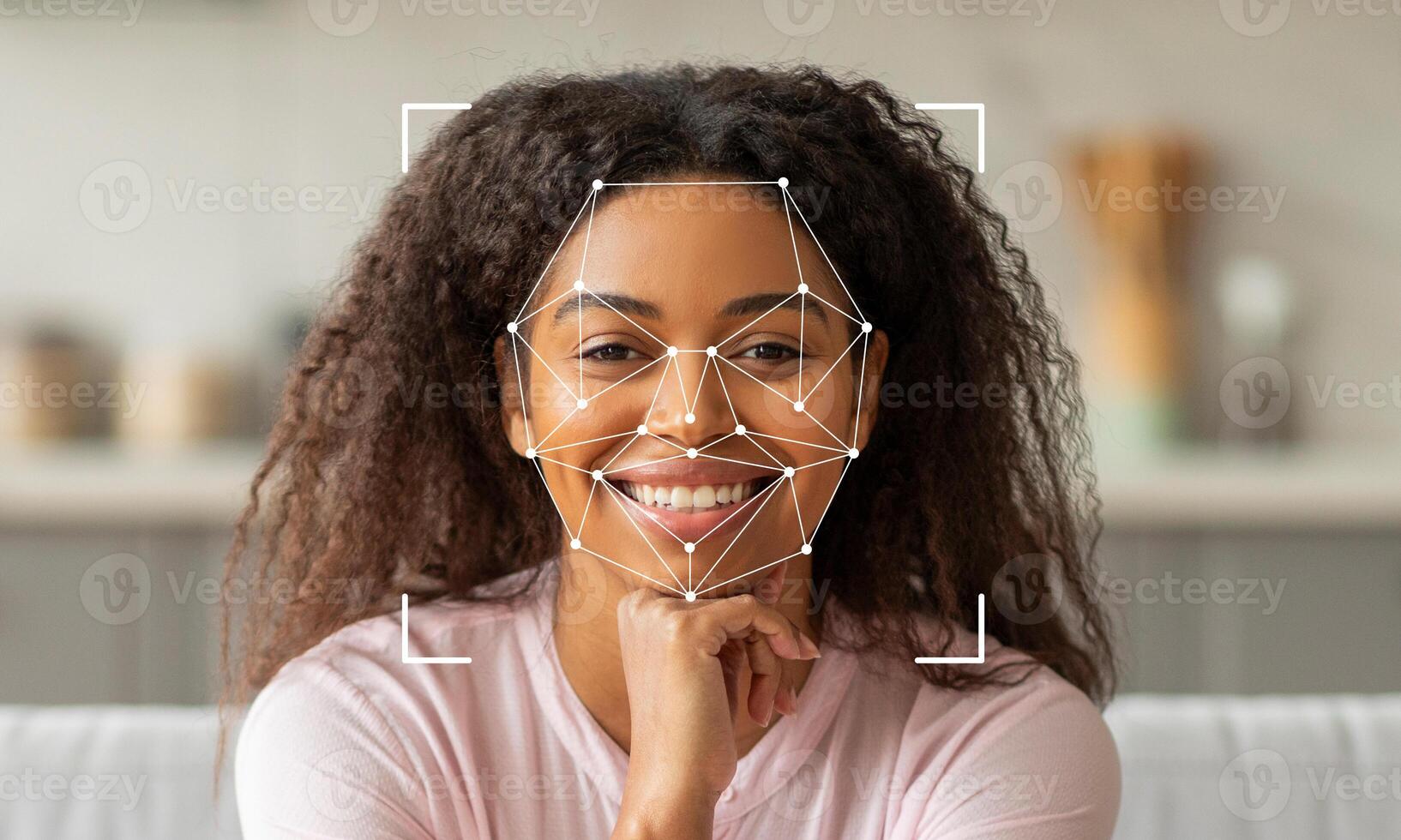 A woman with curly hair is smiling confidently while facial recognition technology detects her features. The background is blurred, emphasizing her expressions and the tech overlay. photo