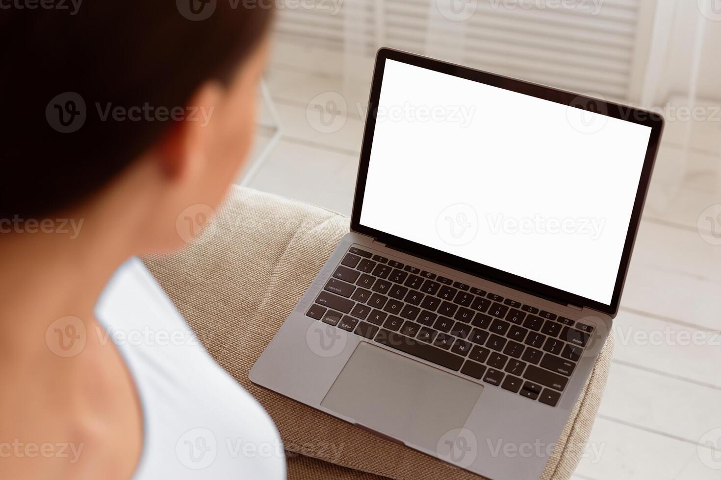 Unrecognizable Woman Looking At Laptop Empty Screen Browsing Internet Sitting At Home. Mockup, Selective Focus photo