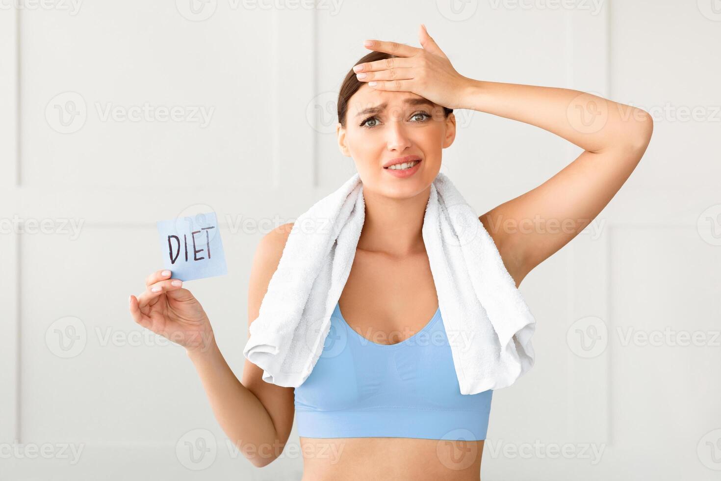 Dieting Concept. Confused Girl Losing Weight Holding Card With Word Diet Slimming At Home. photo