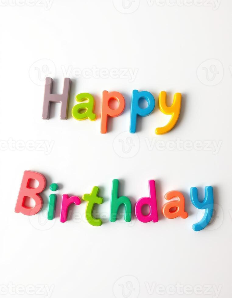 Colorful letters spelling happy birthday on a white background creating a festive atmosphere for celebration photo
