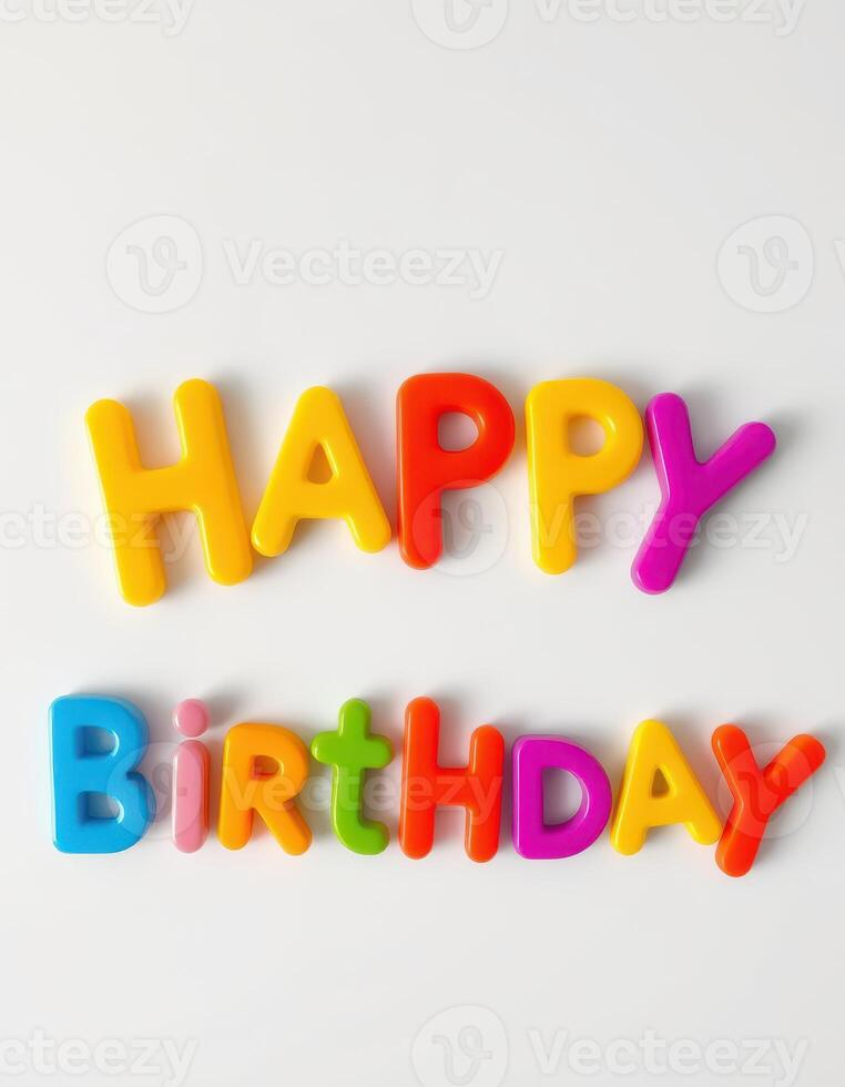 Colorful plastic letters spell happy birthday on a white surface with a playful and festive atmosphere photo