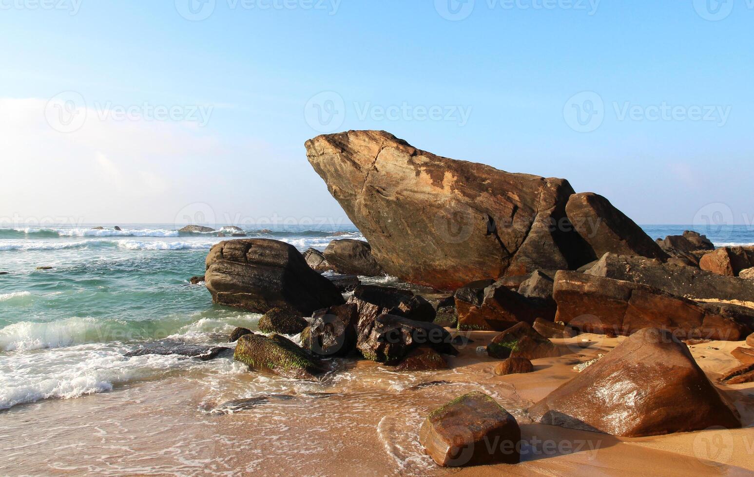 Frog Rock on Dalawella Beach in Sri Lanka on a sunny day. Holidays and vacations in Sri Lanka. Travel nature background photo