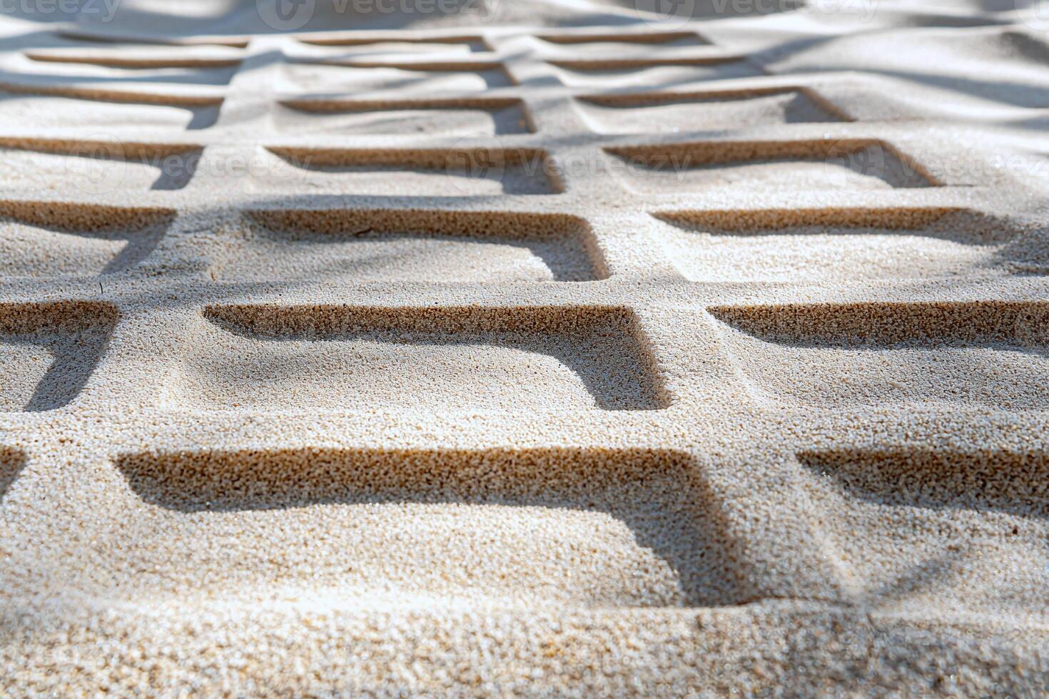 Geometric grid on a warm sand backdrop, offering a minimalist and structured design photo