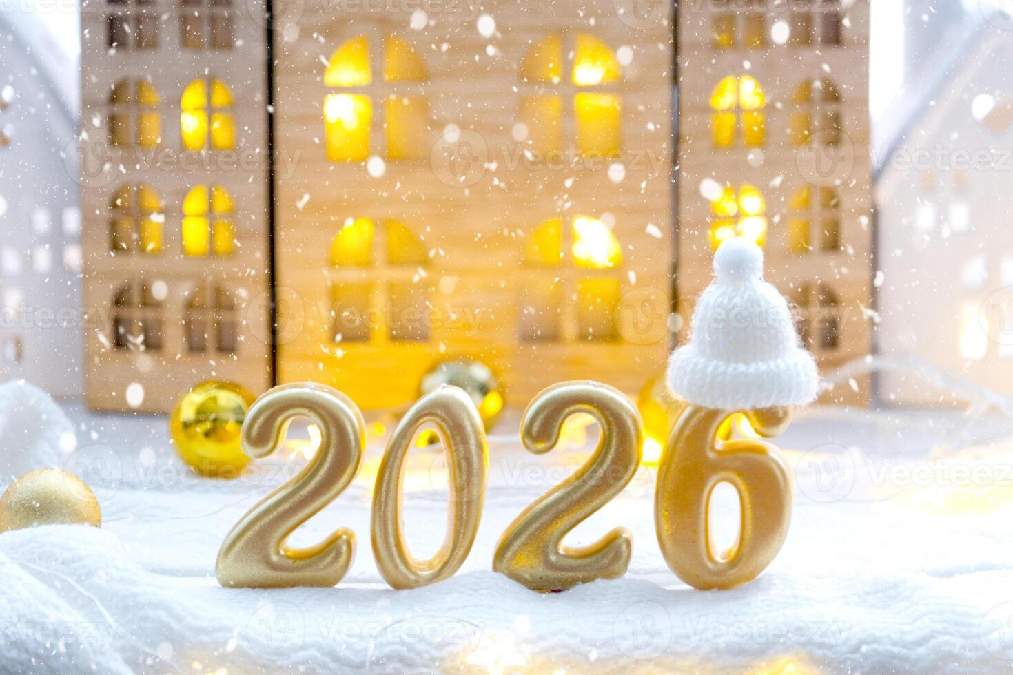 Golden figures number 2026 New Year against background of tiny house with warm light and garlands. Greeting card, Happy New Year, cozy home photo