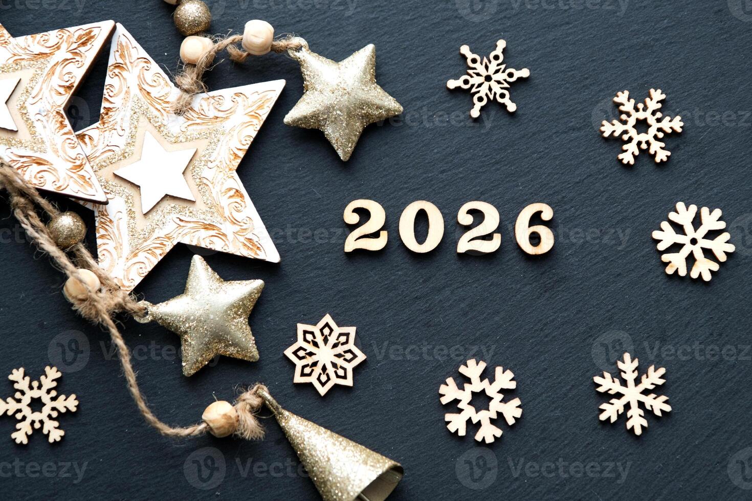Happy New Year-wooden letters numbers 2026 on festive black background with sequins, stars, snow. Greetings, postcard. Calendar, cover photo
