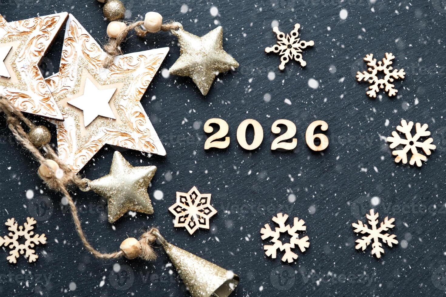 Happy New Year-letters and the numbers 2026 on festive black background with sequins, stars, snow. Greetings, postcard. Calendar, cover photo
