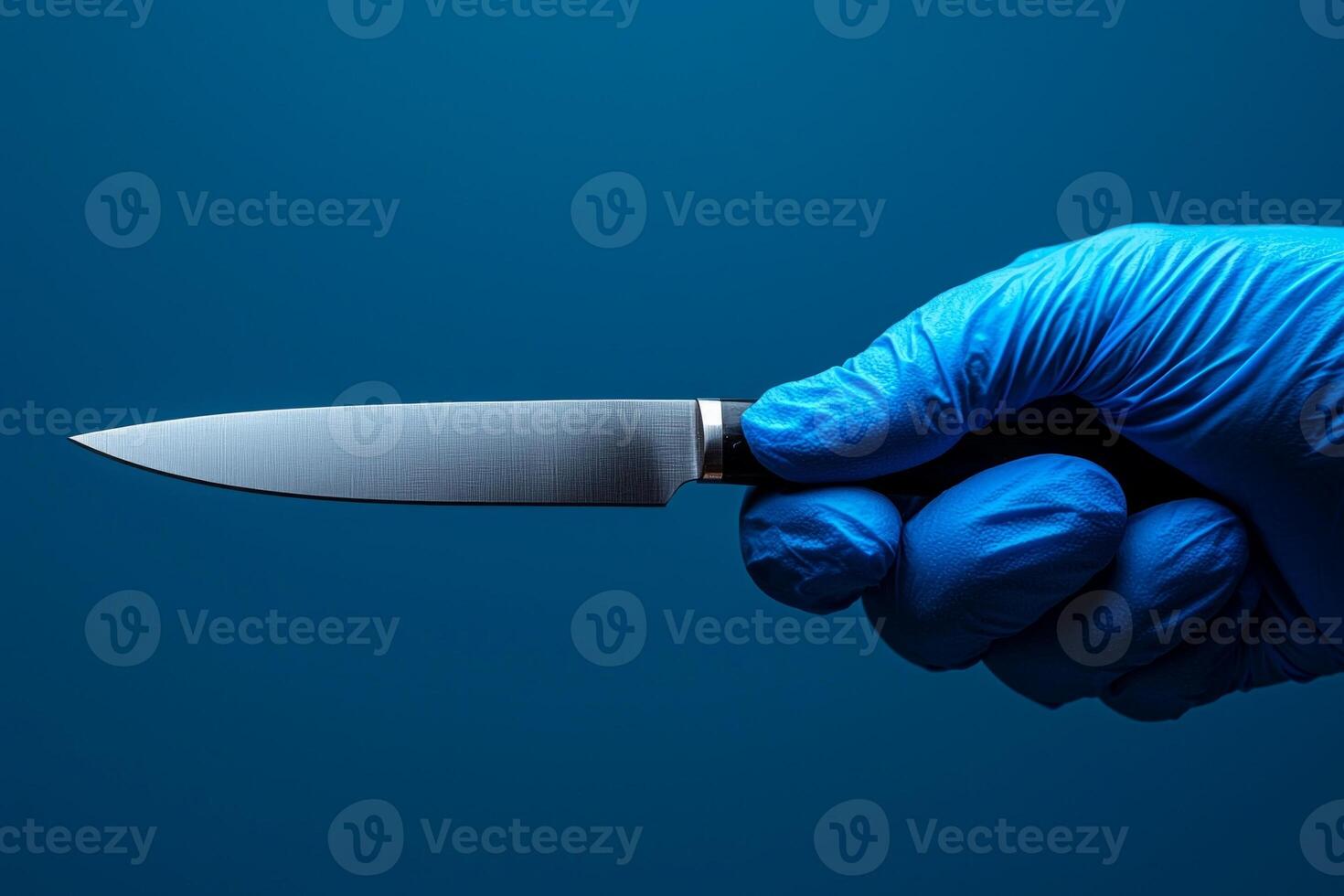 surgeon's hand in blue latex glove grips scalpel firmly showcasing medical precision amidst clean and minimalist background enhances focus photo