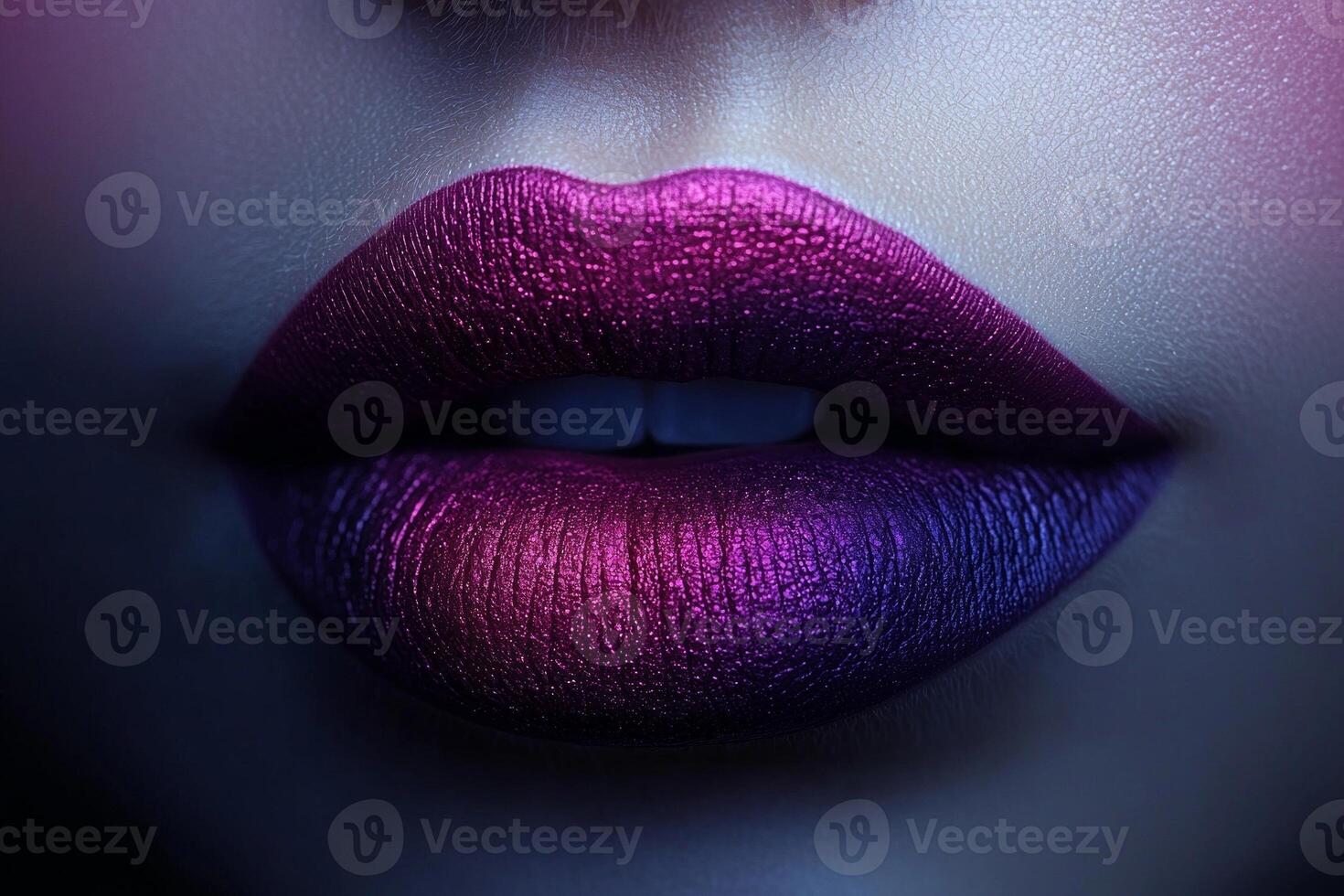 Lips are beautifully painted in ombre effect blending soft pink into deep purple. lighting emphasizes smooth transition and creates striking appearance stands out photo