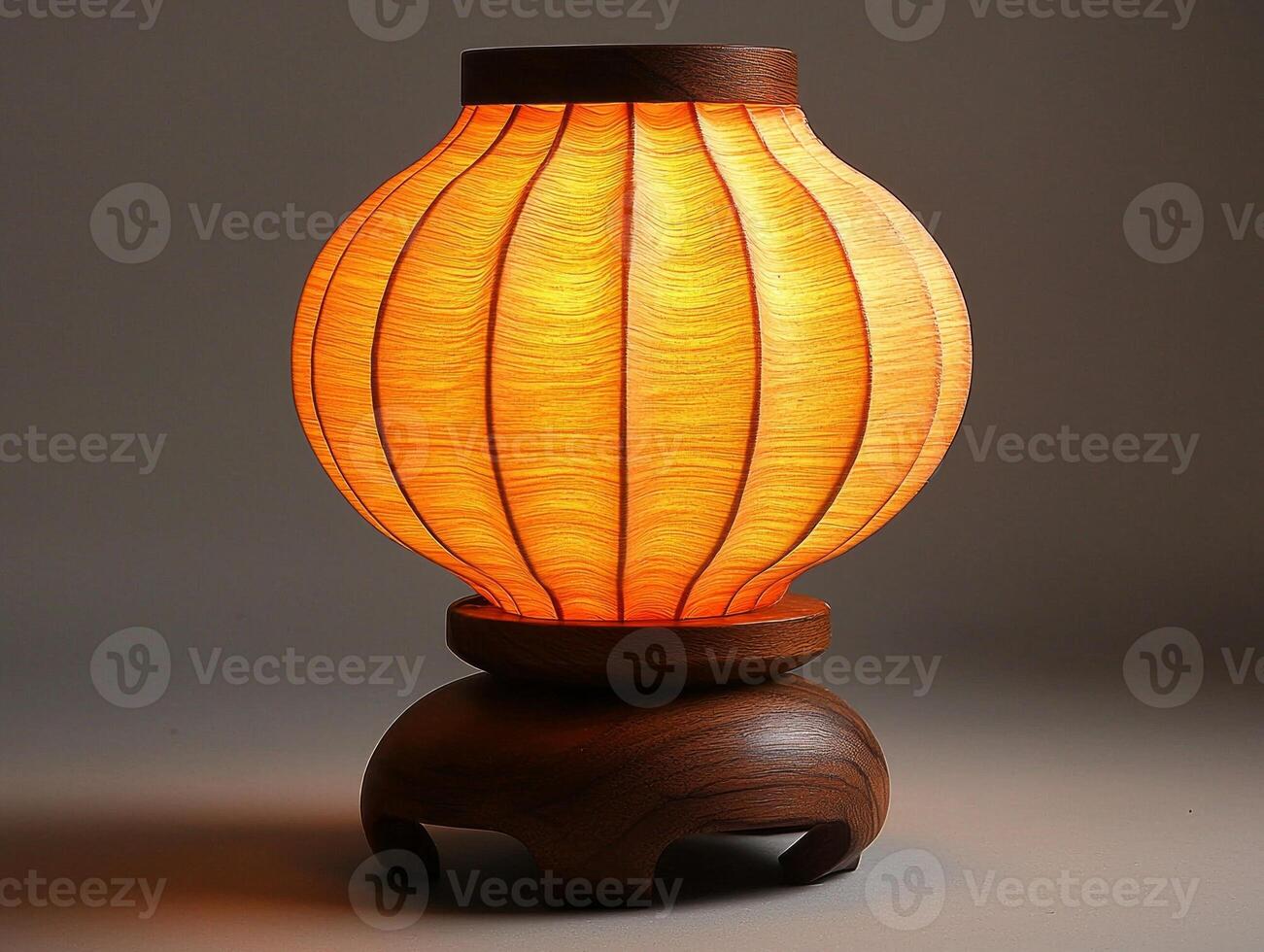 traditional Japanese paper lantern style night lamp emits soft warm glow showcasing its delicate rice paper design and clean wooden base. Perfect for creating calming ambiance photo