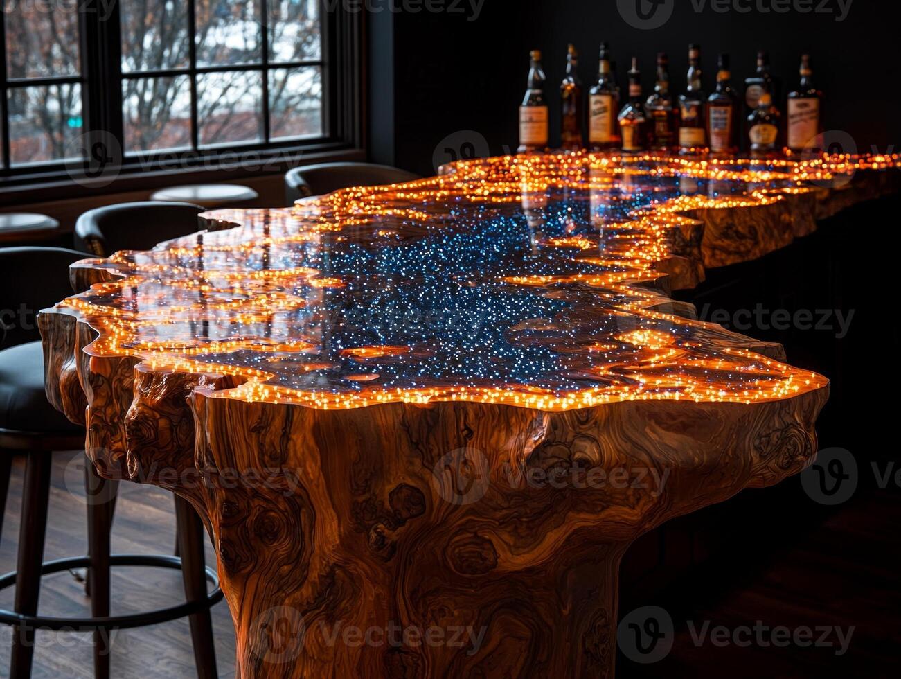 bar counter showcases stunning design made of wood and epoxy resin featuring embedded LED lights illuminate glowing blue pattern enhancing upscale ambiance photo