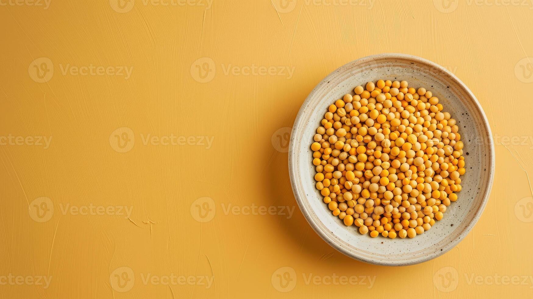 World Pulses Day banner with copy space. Bright yellow seed fill a round plate, showcasing their vibrant color against a matching backdrop. Natural texture and encourages healthy cooking choices. photo
