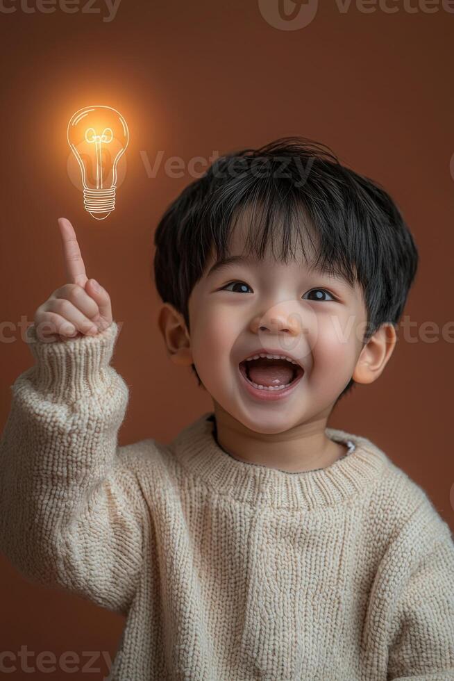 A child is holding up a light bulb photo