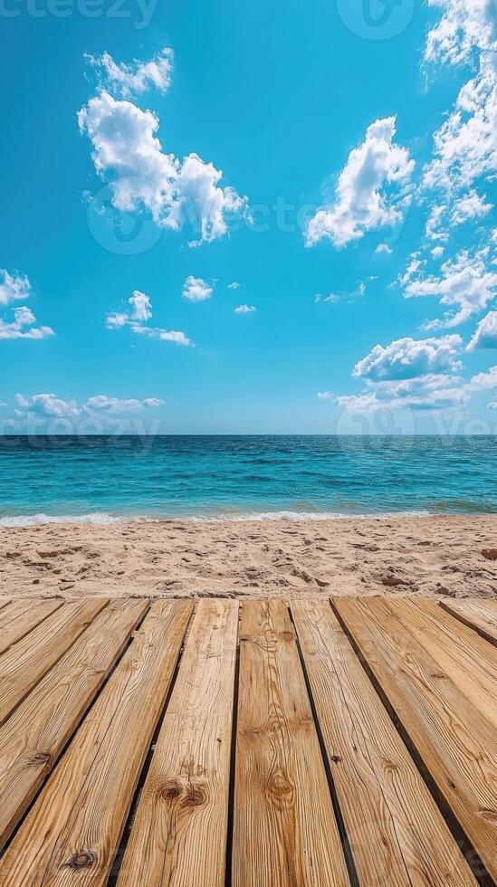 Beach view from a wooden dock with ocean and clear sky, tranquil scene photo