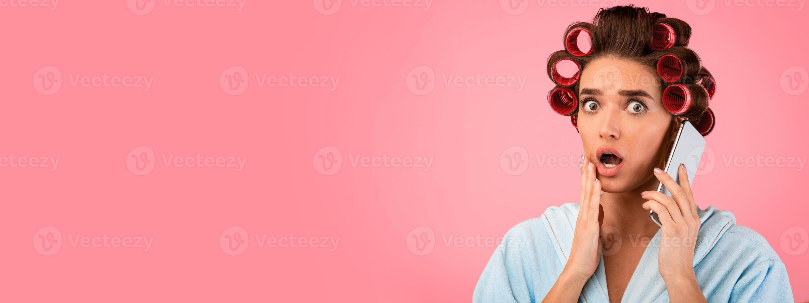 Shocked Housewife Talking On Phone Listening To Shocking Rumors Standing On Yellow Studio Background. Panorama, Copy Space photo