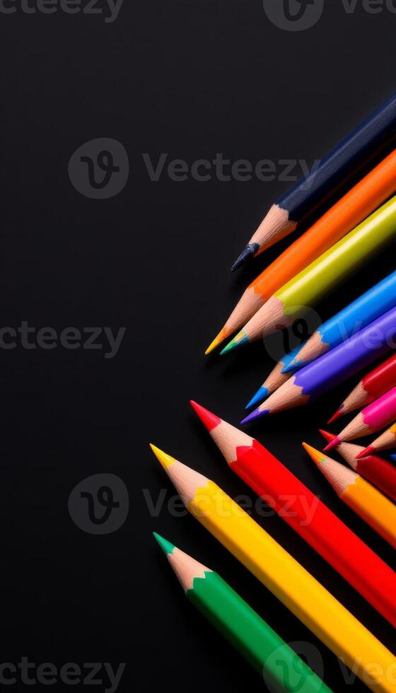 Vibrant Colored Pencils Arranged on a Dark Background Ready for Artistic Expression and Creativity photo