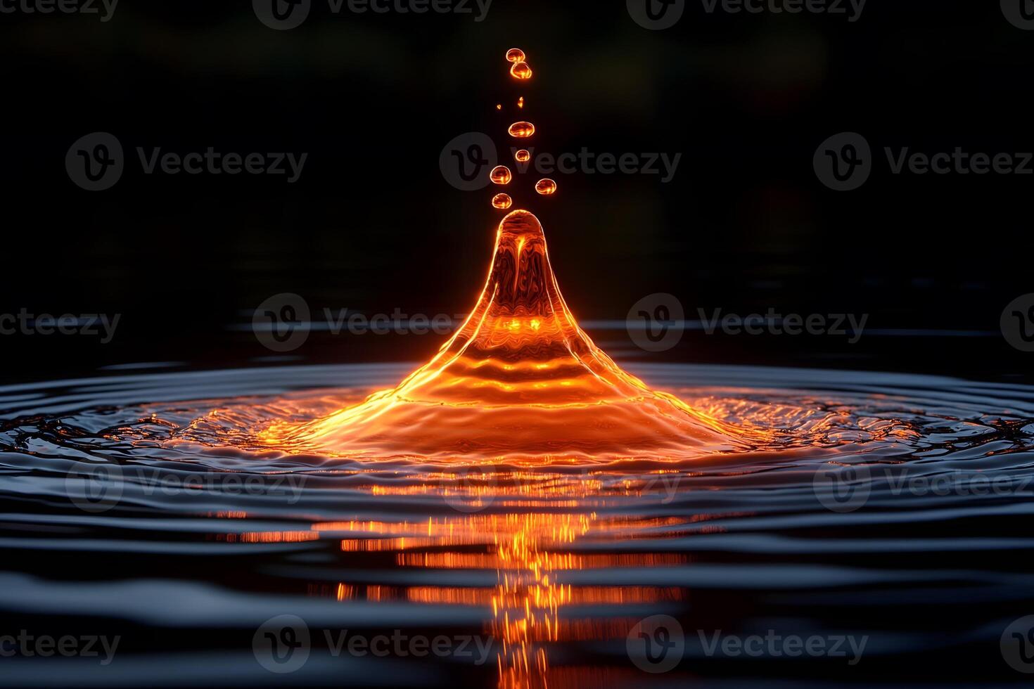 Mesmerizing Water Droplet in Midair Reflecting Fiery Light photo