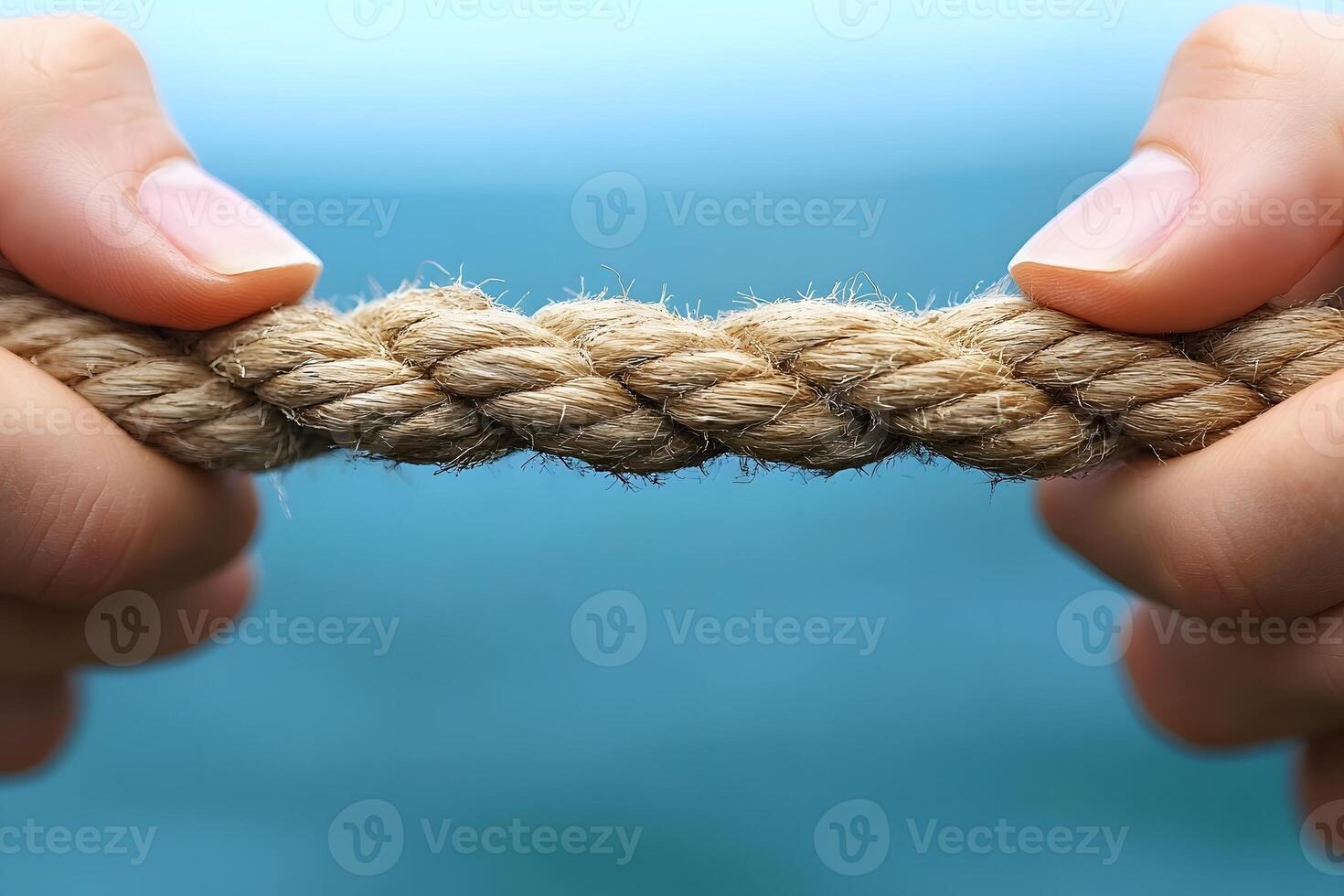 Strength and Tension Concept with Hands Pulling a Sturdy Rope photo