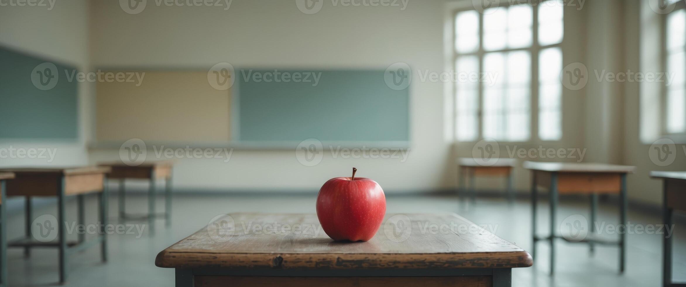 Red Apple Sits On Desk In Empty Classroom. photo