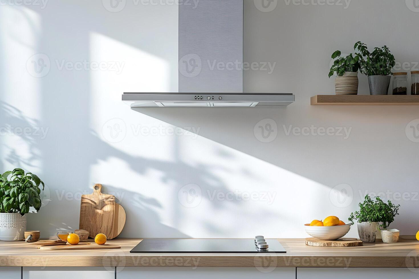 Modern minimalist kitchen with induction cooker and extractor hood photo