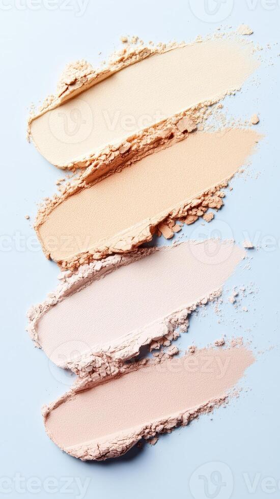 Foundation samples blending across surface, displaying gradient makeup palette for cosmetic compact powder design and artistic color transition photo
