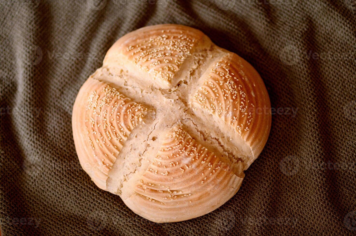 Homemade bread in an interior with a warm light and plant photo