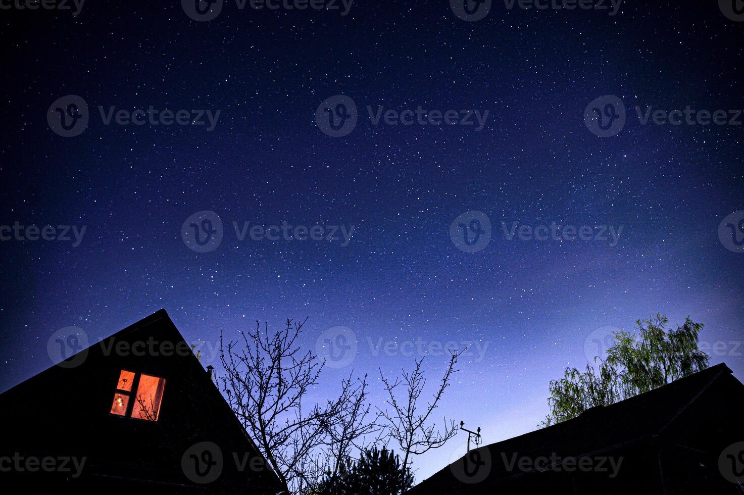 A house under the starry sky in the Russian village photo