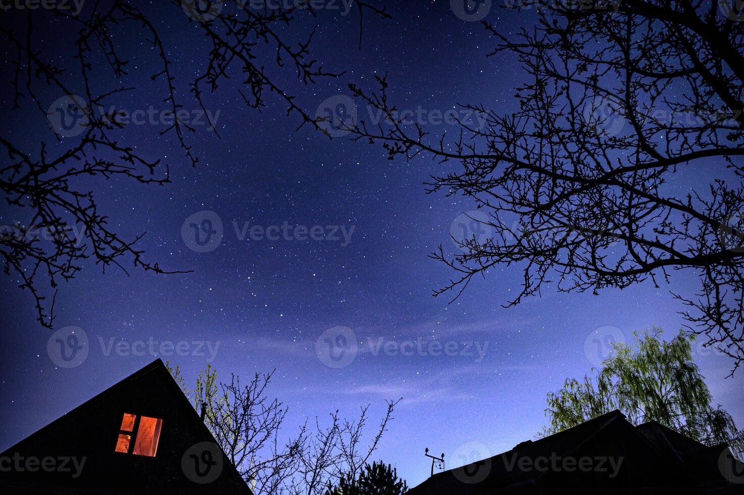 A house under the starry sky in the Russian village photo