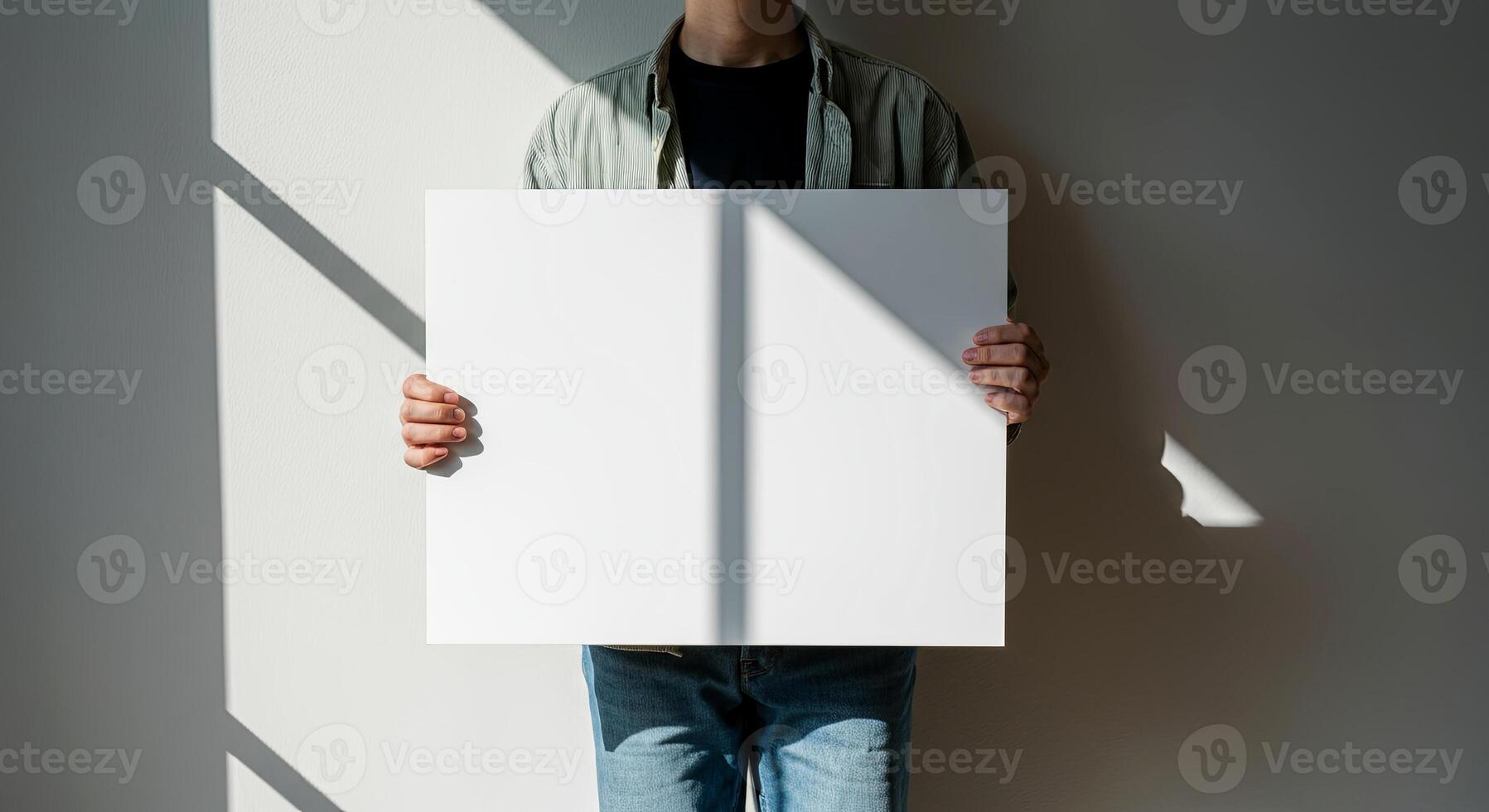 A mysterious figure holds a blank canvas, inviting endless possibilities photo