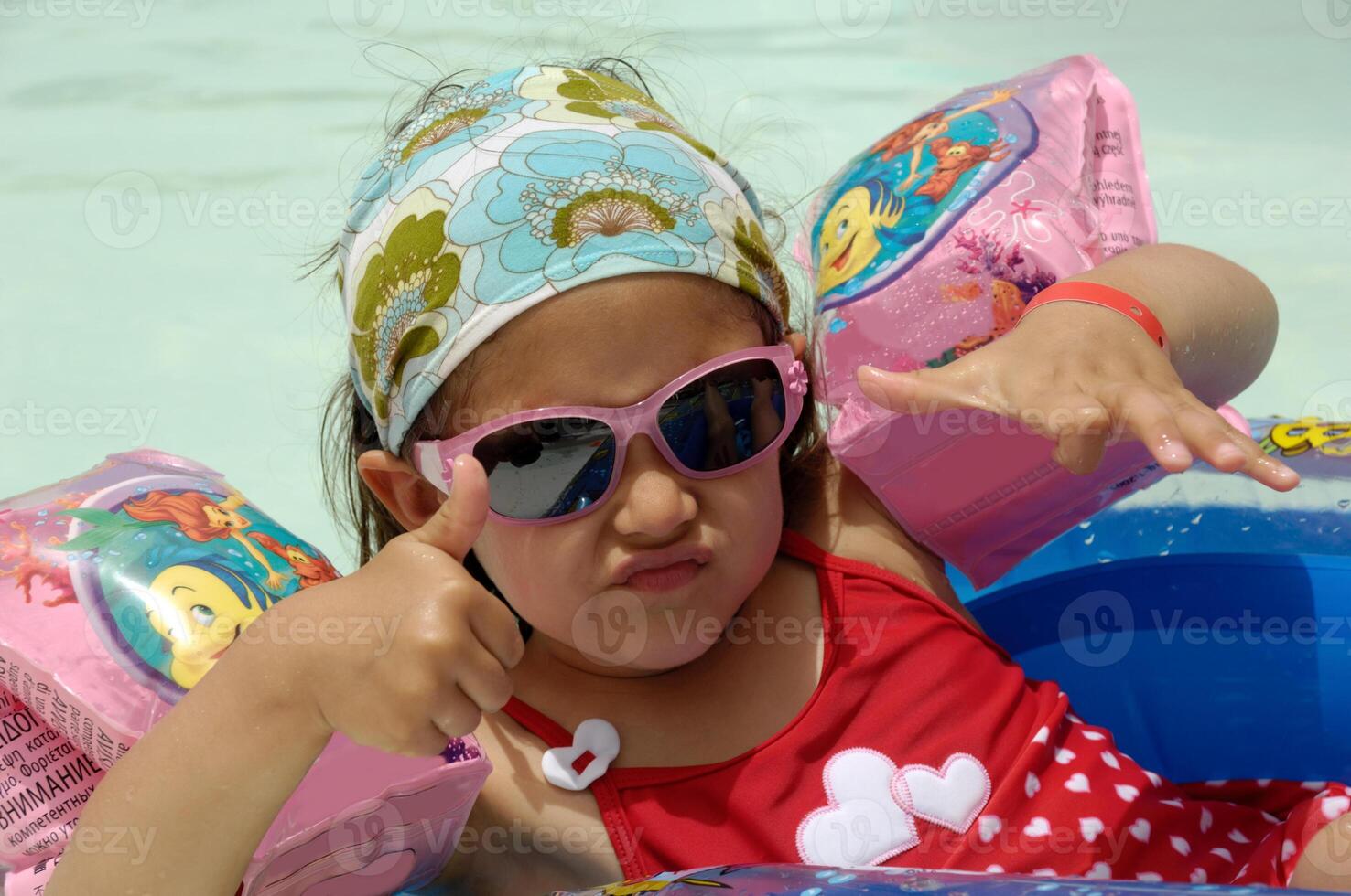 cool child in pool photo