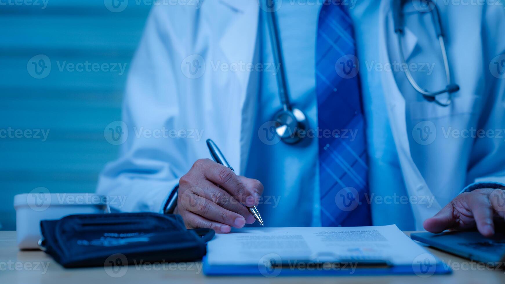 Focused healthcare professional in white coat, writing notes and collaborating on patient assessments scene highlights importance of thorough evaluation and care in medical practice photo