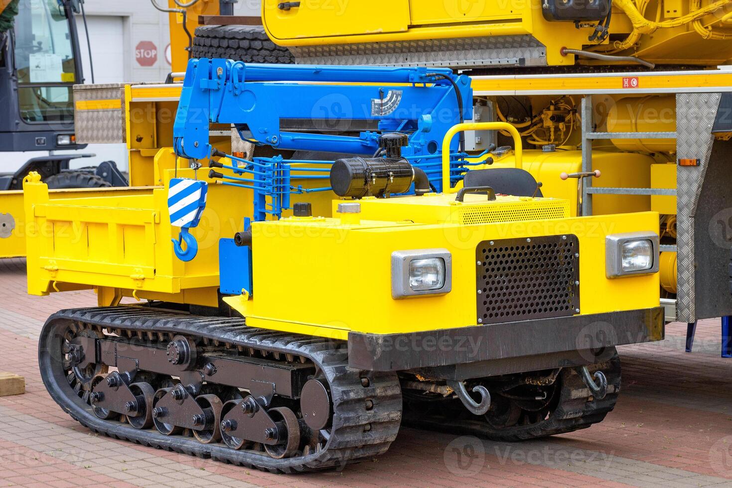 Mobile construction crane yellow blue color with telescopic loading platform. photo