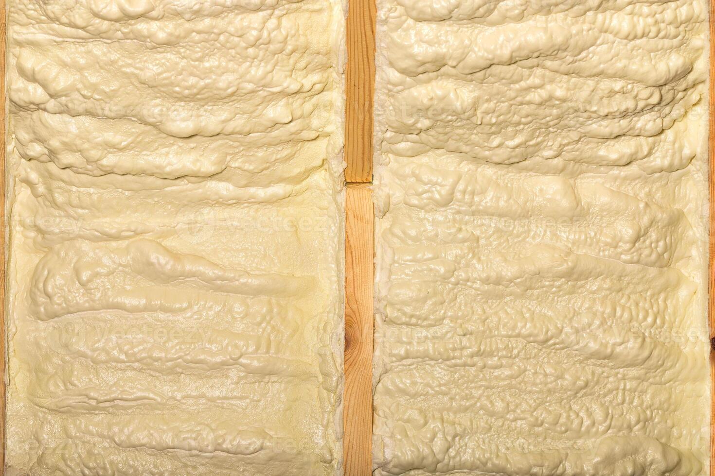 Expressive texture of building yellow foam on the wall. photo