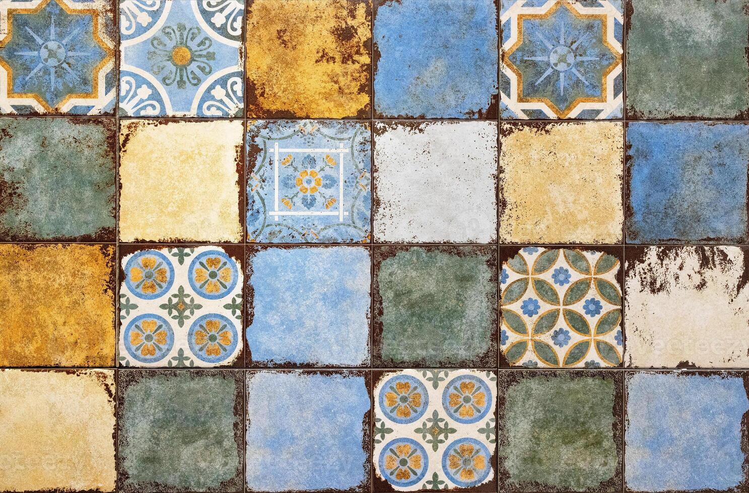 Background of multi-colored aged ceramic tiles. photo