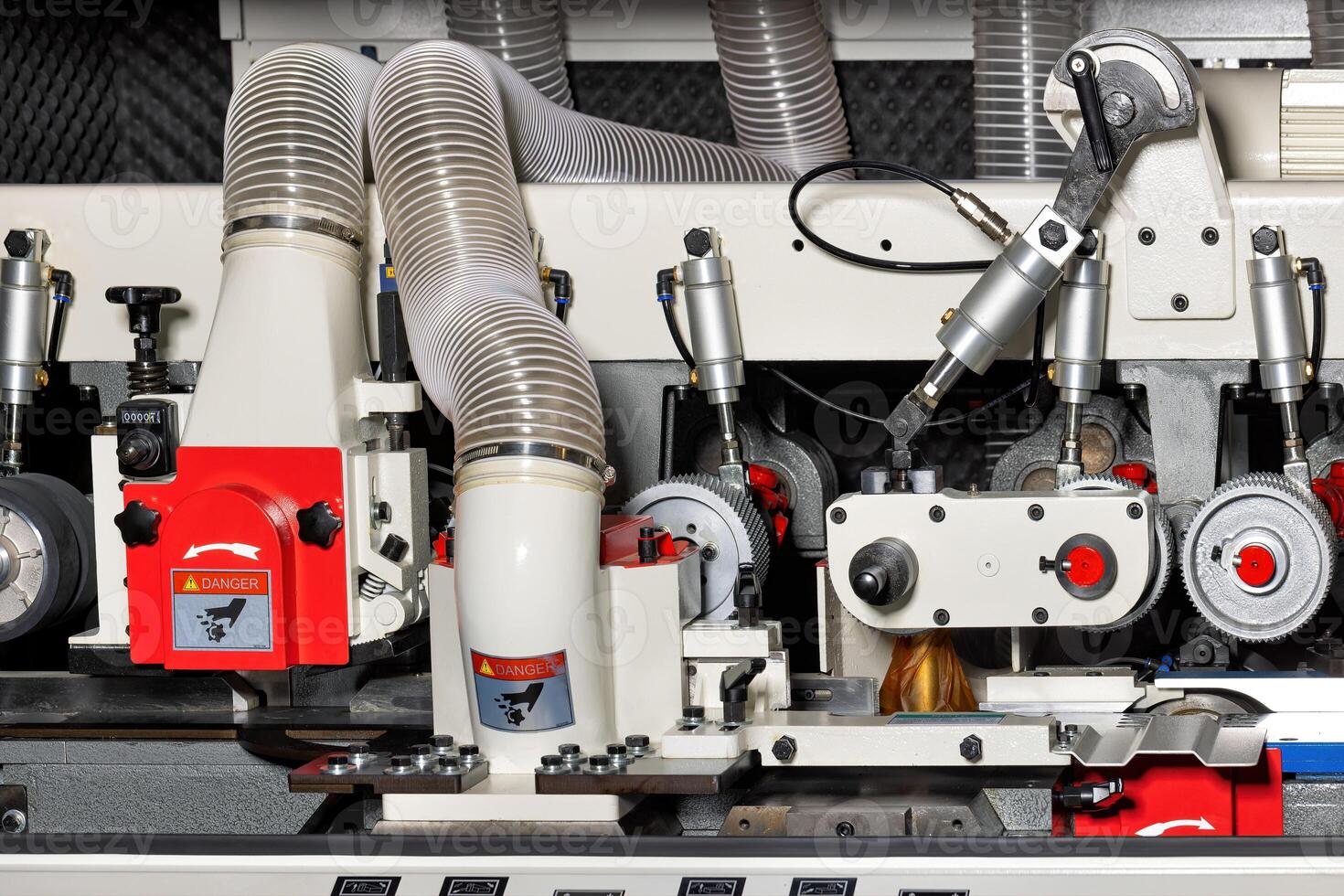 Precision woodworking machinery in action at a workshop during daytime operations photo
