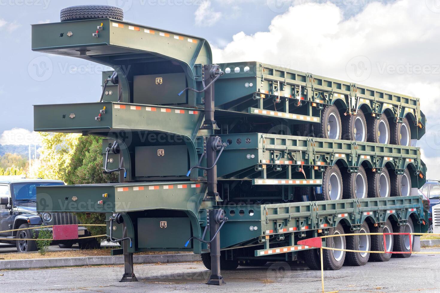Innovative stacked transport trailers on display in a vibrant outdoor setting. photo