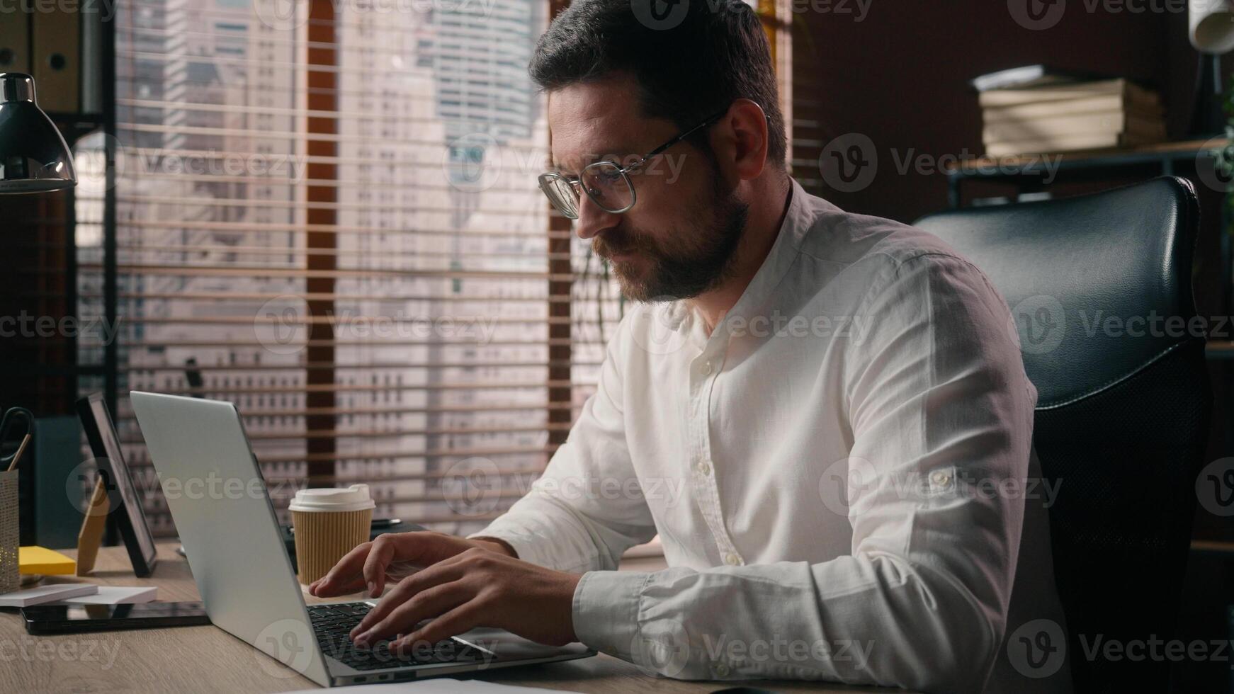 Caucasian ceo business leader guy developer male sip coffee drink beverage cup in office employer executive open laptop businessman agent begin workday job man manager starting working occupation tech photo