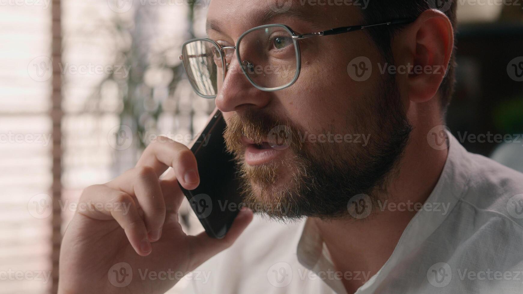 Close up joyful Caucasian agent male employer worker conversation man manager communicate guy businessman speak mobile phone in office broker boss business call executive ceo smiling client connection photo