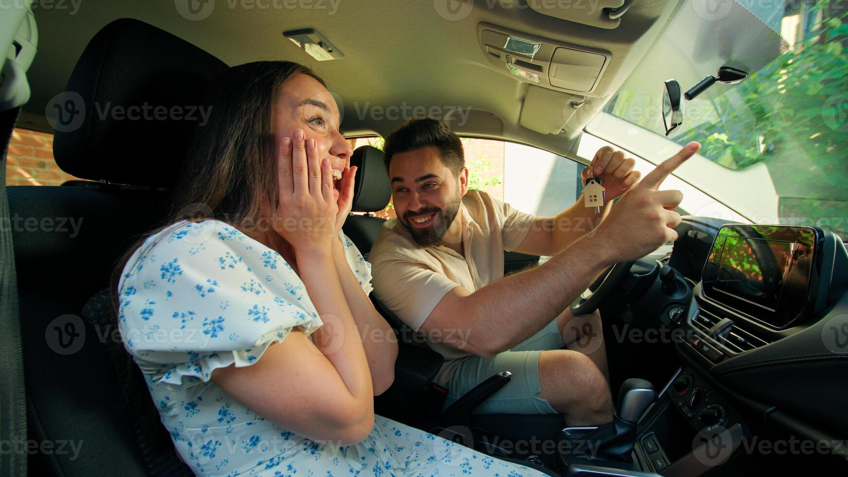 Caucasian family purchase happy shocked excited woman female girl rejoice gesturing wow man male guy showing flat keys buying home buy house homeowner housing rent real estate inside automobile car photo
