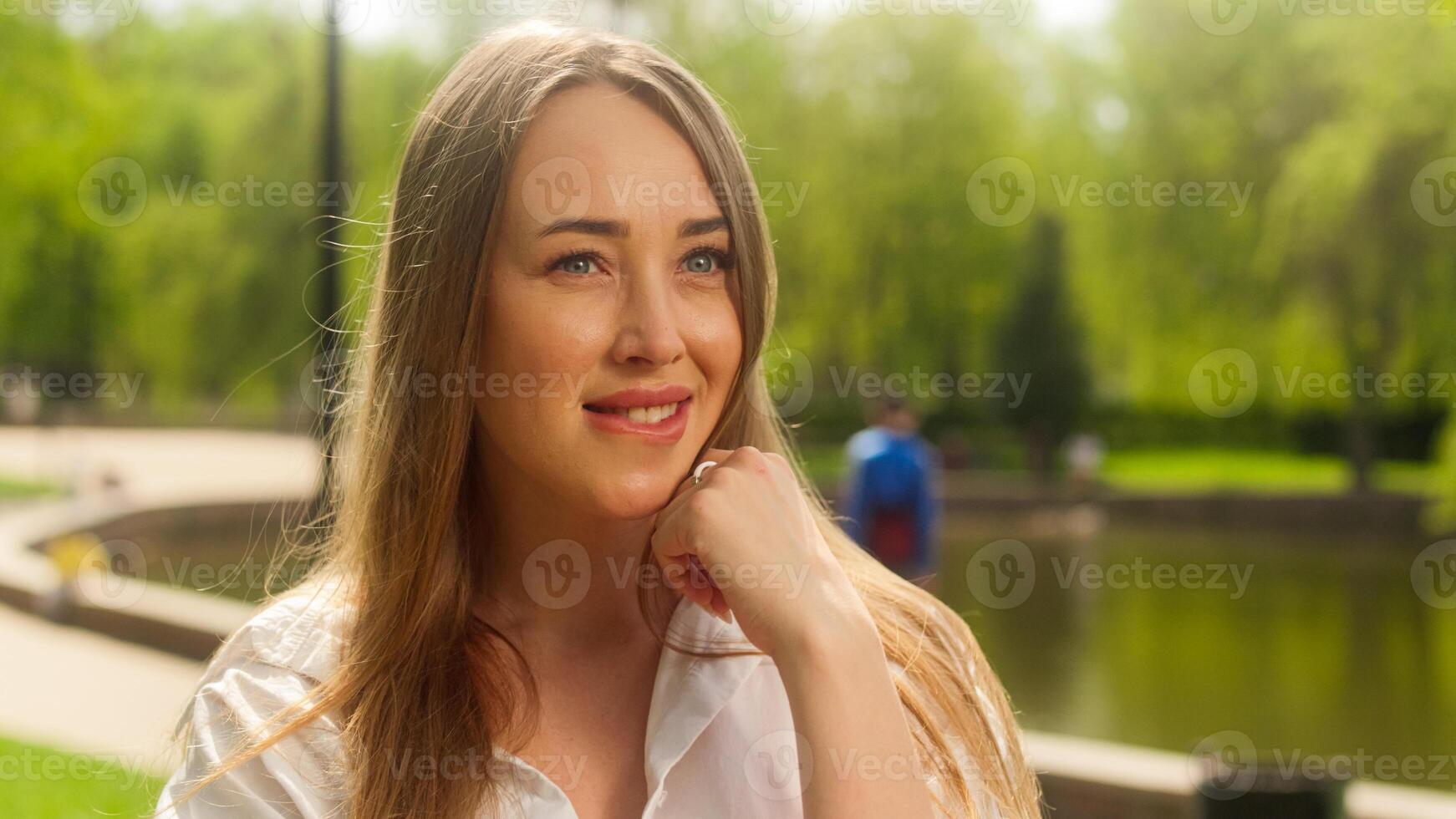 European woman female biting lip flirting smiling desire facial expression glamour beauty sensuality pointing finger fashion communicate emotional park city lady positive confused anticipation girl photo